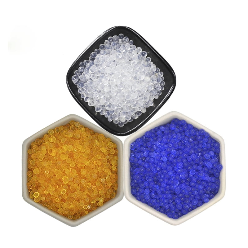 different types of silica gel desiccant orange white blue beads side by side in bowls